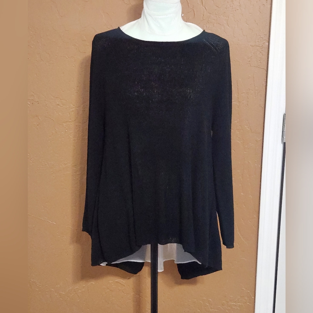 Liteweight sweater with poly under the back. Really feminine. NWT